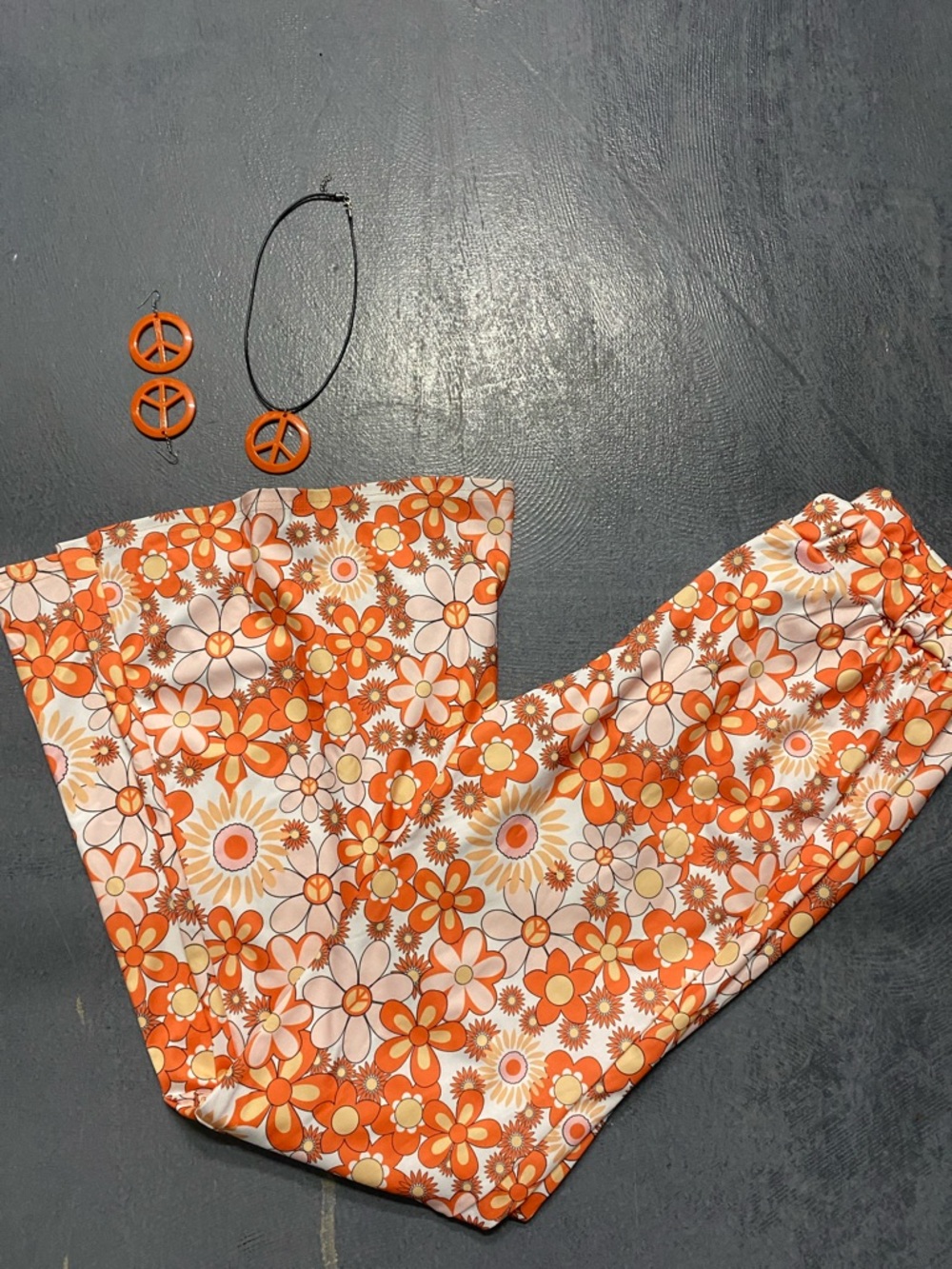 Vintage-Inspired Orange Floral  Pants with Peace Sign Jewelry